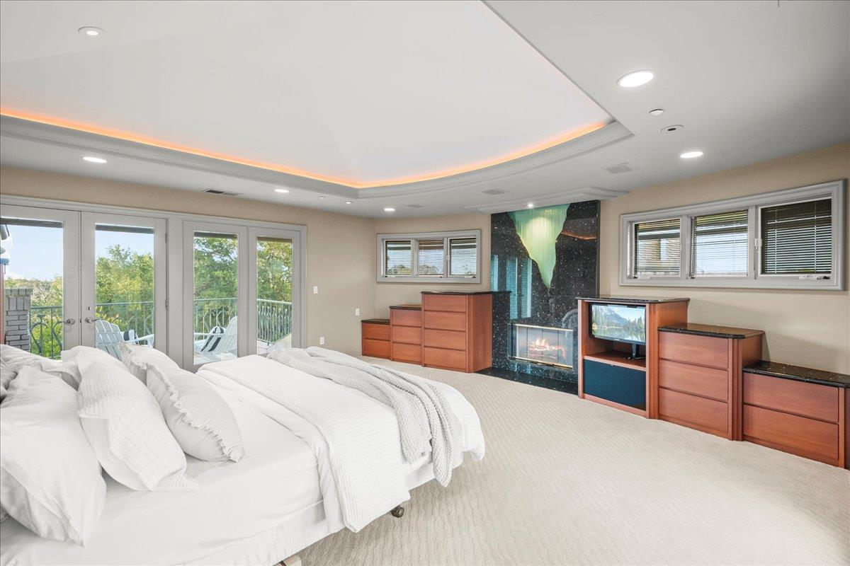 14467 Sobey Road Saratoga, CA 95070 - Photo 21 of 61 a bedroom with a large bed and a dresser