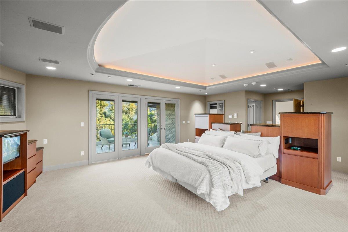 14467 Sobey Road Saratoga, CA 95070 - Photo 22 of 61 a bedroom with a large bed and a large window