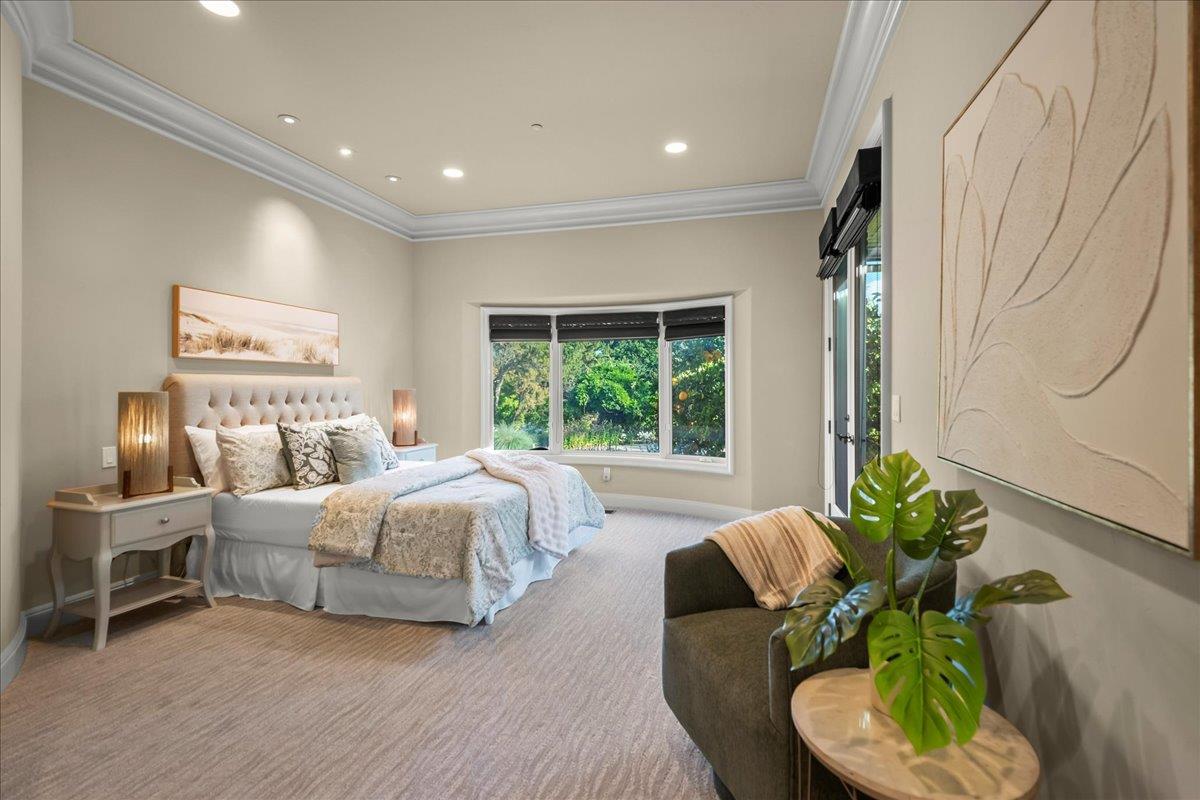 14467 Sobey Road Saratoga, CA 95070 - Photo 28 of 61 a spacious bedroom with a bed and a couch