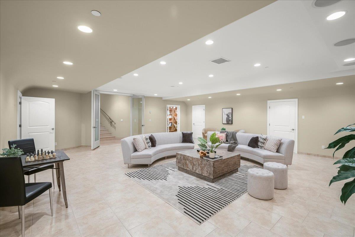 14467 Sobey Road Saratoga, CA 95070 - Photo 30 of 61 a living room with furniture and a potted plant