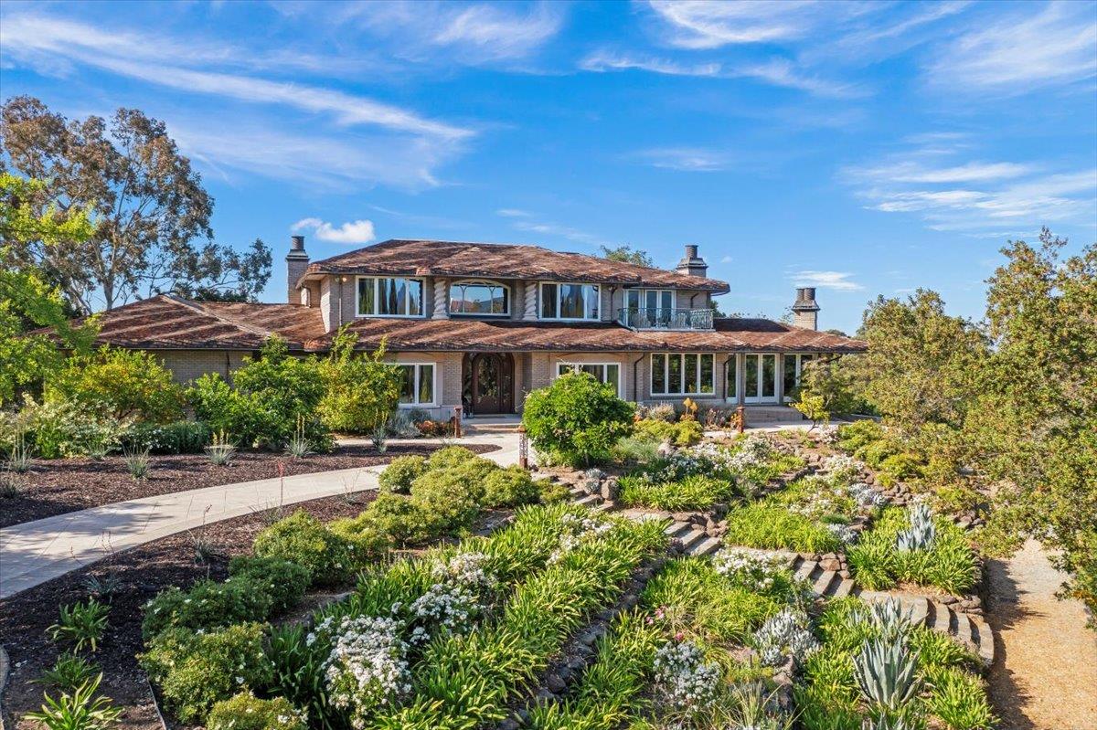 14467 Sobey Road Saratoga, CA 95070 - Photo 3 of 61 a front view of a house with a yard