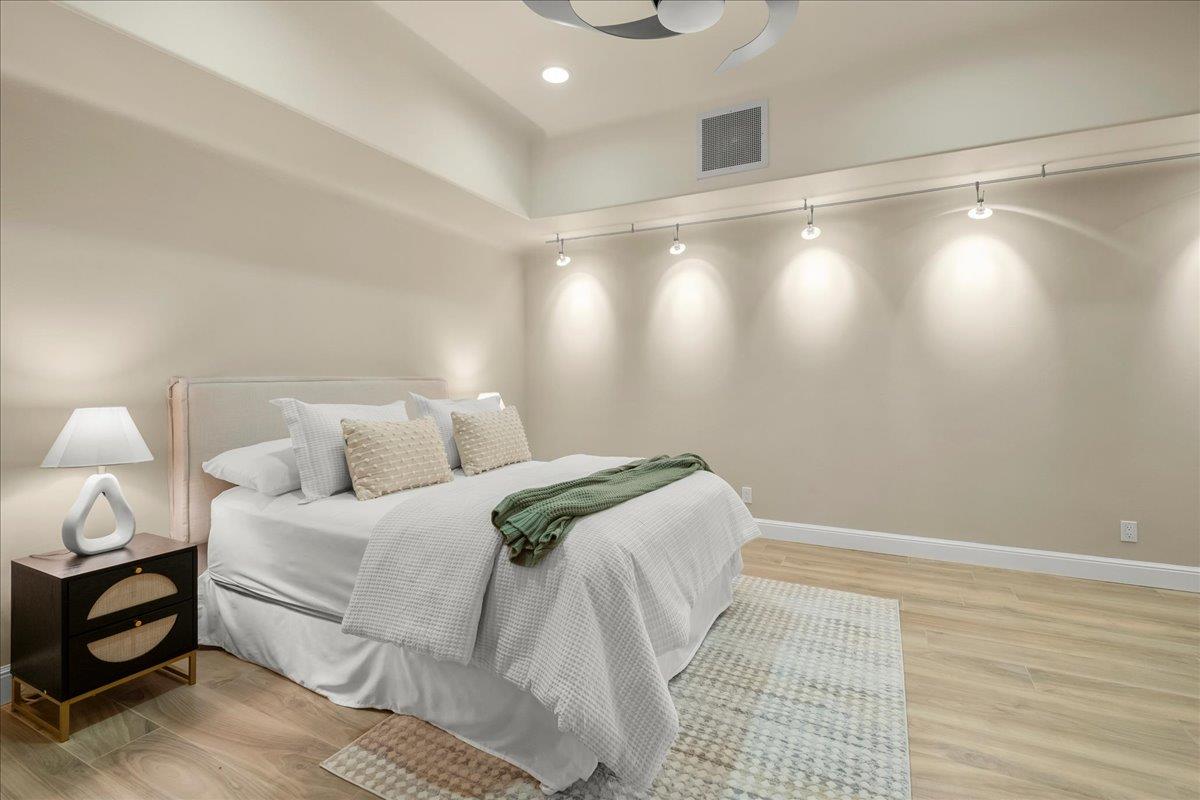 14467 Sobey Road Saratoga, CA 95070 - Photo 36 of 61 a bedroom with a bed and a night stand