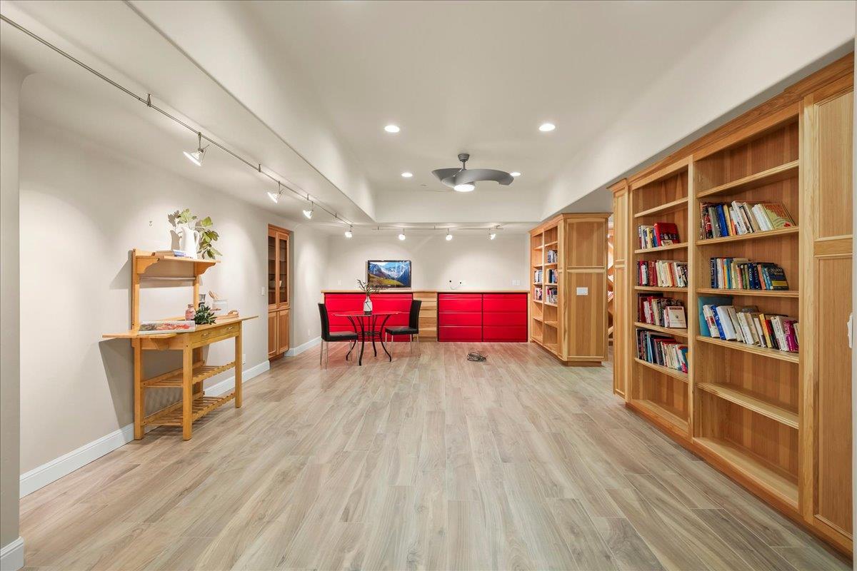 14467 Sobey Road Saratoga, CA 95070 - Photo 38 of 61 a living room with furniture and a book shelf