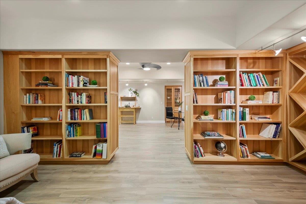 14467 Sobey Road Saratoga, CA 95070 - Photo 39 of 61 a living room with furniture and a book shelf