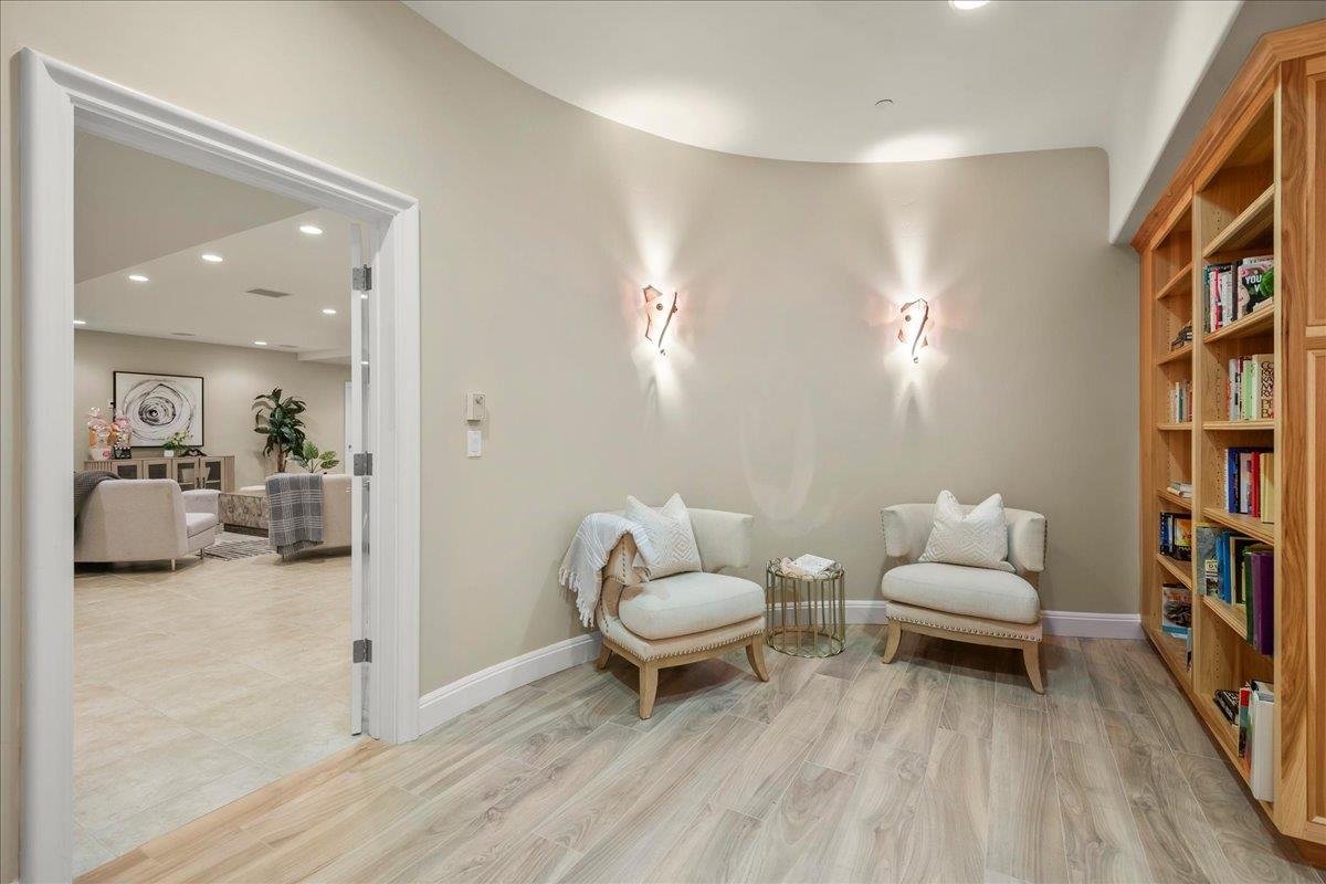 14467 Sobey Road Saratoga, CA 95070 - Photo 42 of 61 a living room with furniture and a book shelf