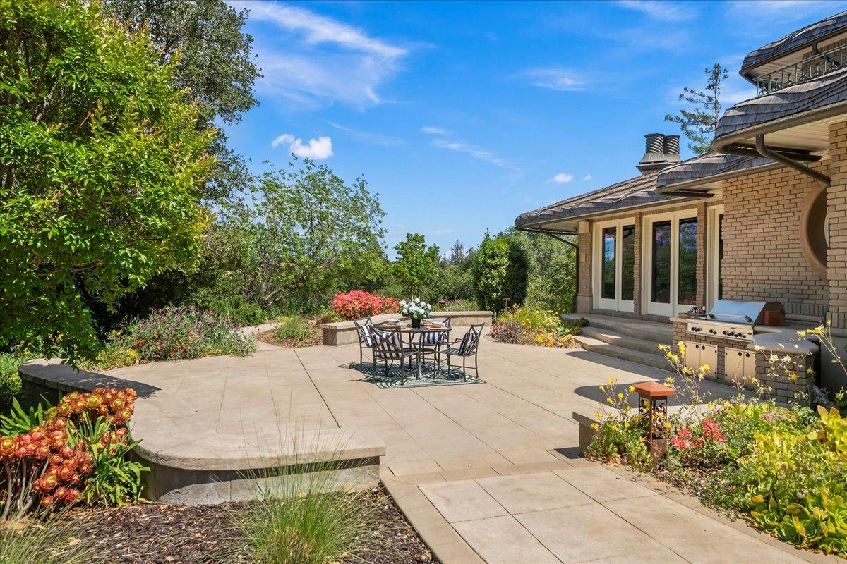 14467 Sobey Road Saratoga, CA 95070 - Photo 47 of 61 a view of a patio with table and chairs and potted plants