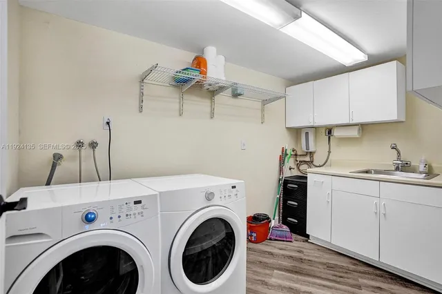 a view of kitchen sink and washer dryer