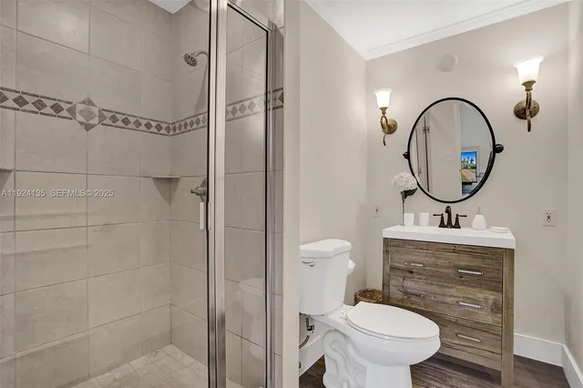 a bathroom with a toilet a sink and a mirror