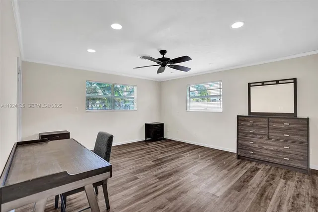 a workspace with furniture window and wooden floor