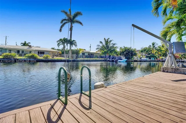 a view of a lake with a table and chairs