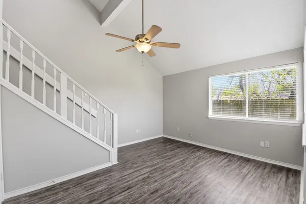a view of an entryway with wooden floor