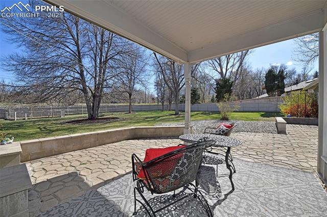 2421 Strickler Road Colorado Springs, CO 80906 - Photo 16 of 44 View of patio / terrace with a fenced backyard