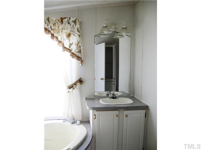 1601 Morgan Road Benson, NC 27504 - Photo 13 of 25 One of the vanities in the master bath.