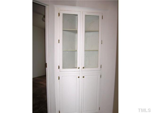 1601 Morgan Road Benson, NC 27504 - Photo 16 of 25 This built in cabinet sits in the hallway between the secondary bedrooms.