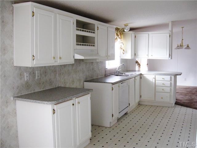 1601 Morgan Road Benson, NC 27504 - Photo 5 of 25 Kitchen with lots of cabinets and natural light