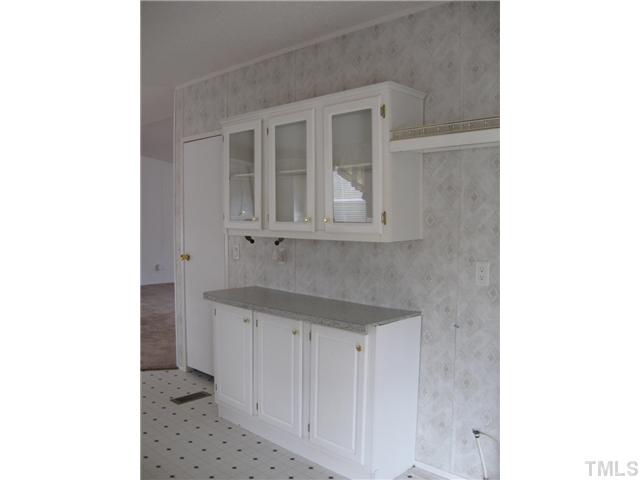 1601 Morgan Road Benson, NC 27504 - Photo 6 of 25 More cabinets in the kitchen - some with glass doors!
