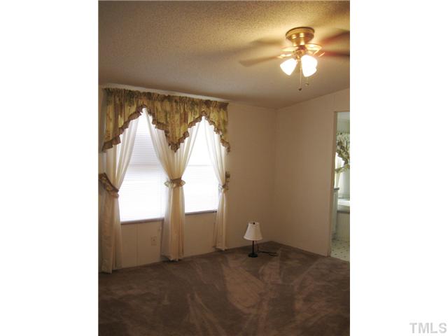 1601 Morgan Road Benson, NC 27504 - Photo 10 of 25 Master bedroom with ceiling and huge walk in closet.