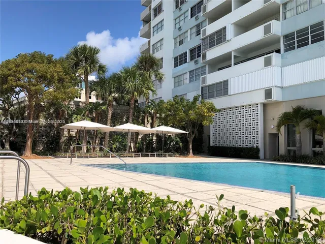 a living room with furniture and white walls