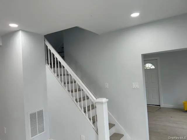 an entryway in a hall with a window