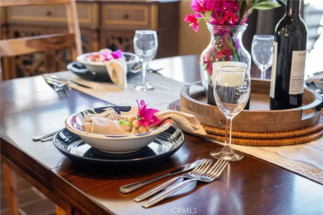 a dining room with furniture and wooden floor