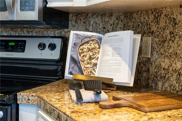 a bedroom with furniture and a large window