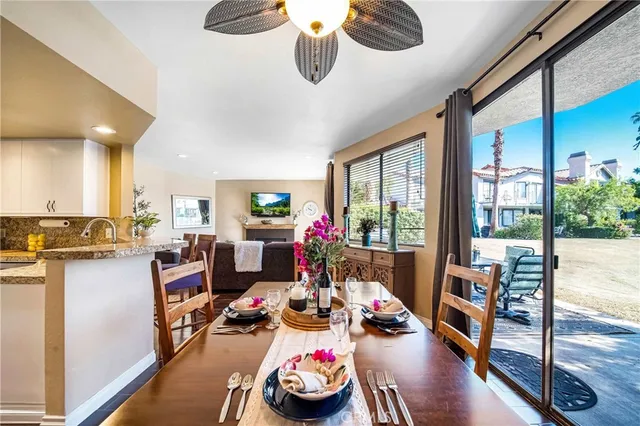 a bedroom with a bed and dresser with mirror