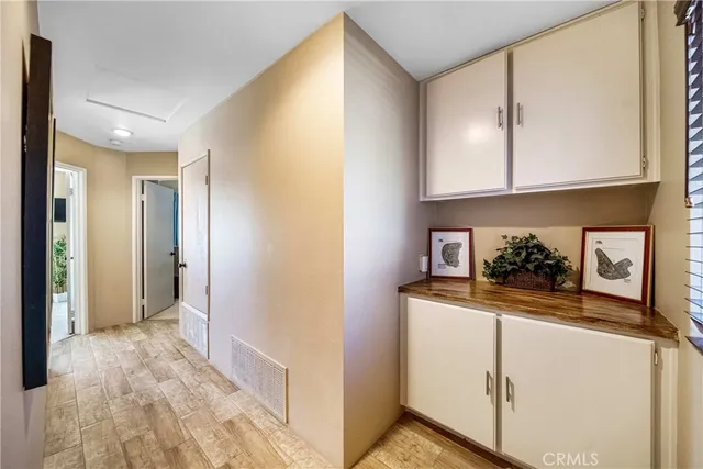 a view of a backyard with swimming pool and sitting area