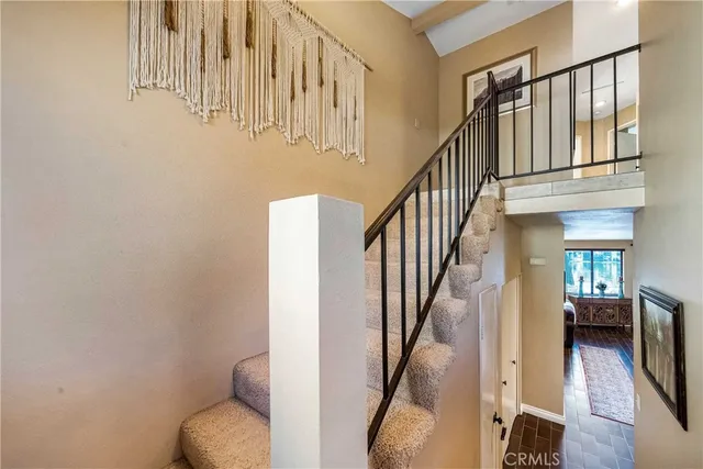a view of a chairs and table in patio with a lake view