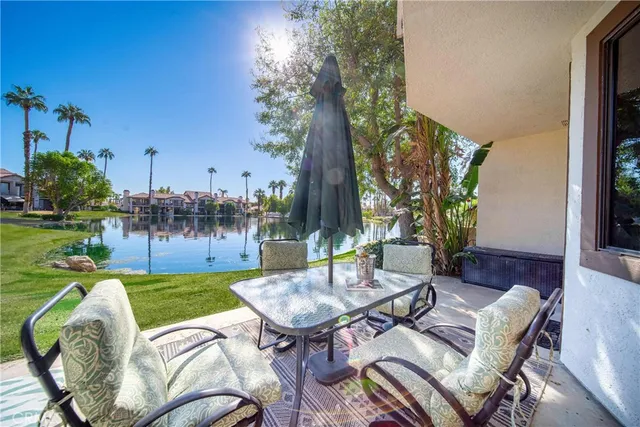 a view of a backyard with sitting area