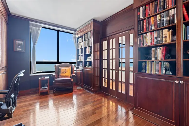 a reading room with lots of furniture and a book shelf
