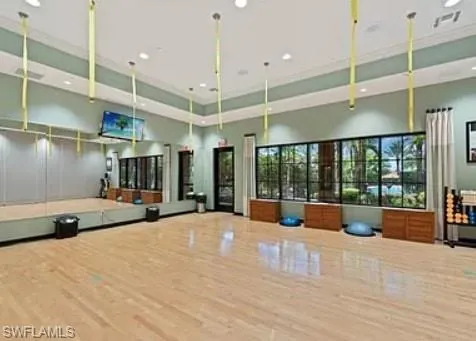 a large white kitchen with a large window