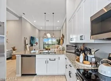a kitchen with sink a stove and cabinets