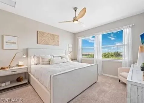a bedroom with a bed mirror and window