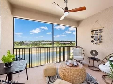 9397 Pocida Court, Unit 203 Naples, FL 34119 - Photo 31 of 32 a living room with furniture and a floor to ceiling window