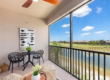 9397 Pocida Court, Unit 203 Naples, FL 34119 - Photo 32 of 32 a view of a balcony with chairs and a potted plant