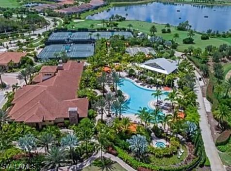 9397 Pocida Court, Unit 203 Naples, FL 34119 - Photo 5 of 32 an aerial view of residential house with outdoor space and swimming pool