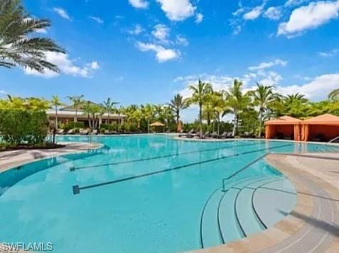 9397 Pocida Court, Unit 203 Naples, FL 34119 - Photo 8 of 32 a view of a yard with swimming pool