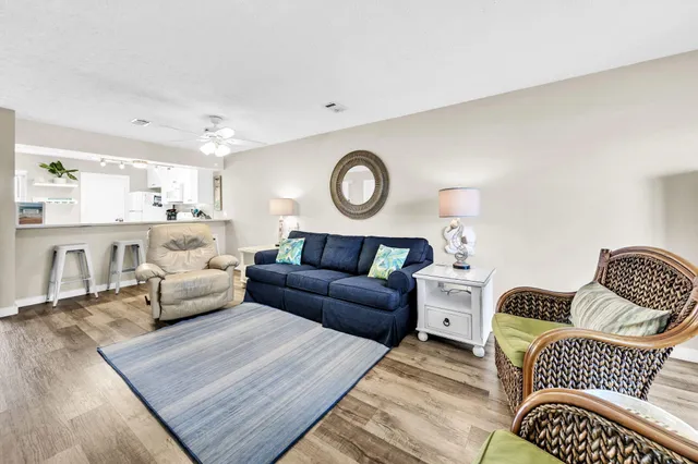 a living room with furniture and a lamp