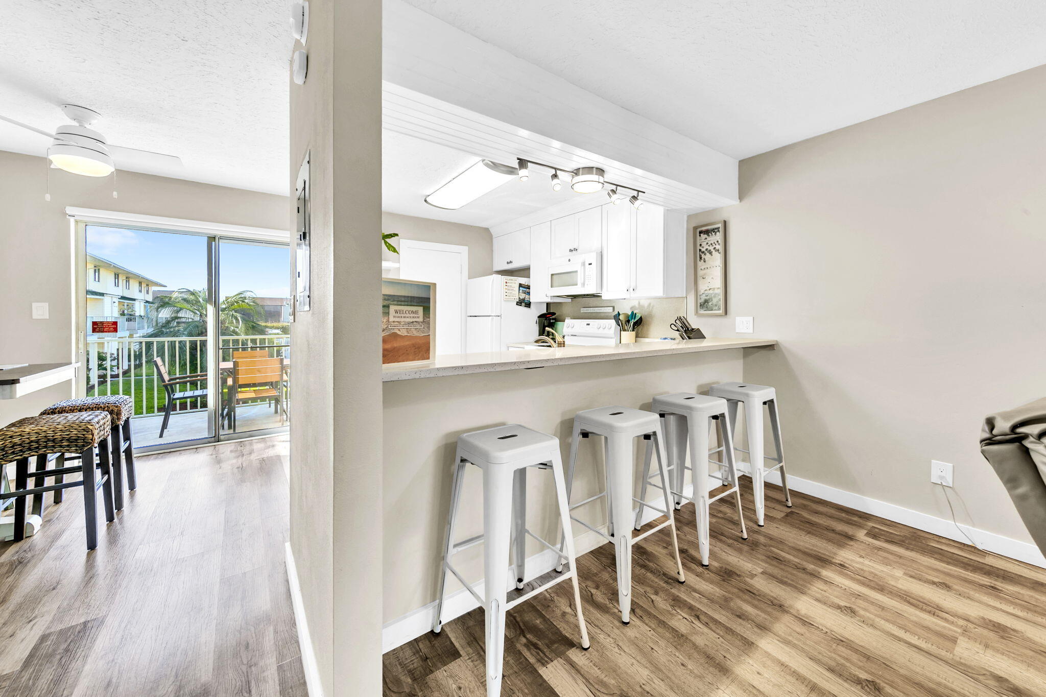 60 Sandprints Drive, Unit C12 Miramar Beach, FL 32550 - Photo 14 of 53 a dining room with furniture wooden floor and a rug