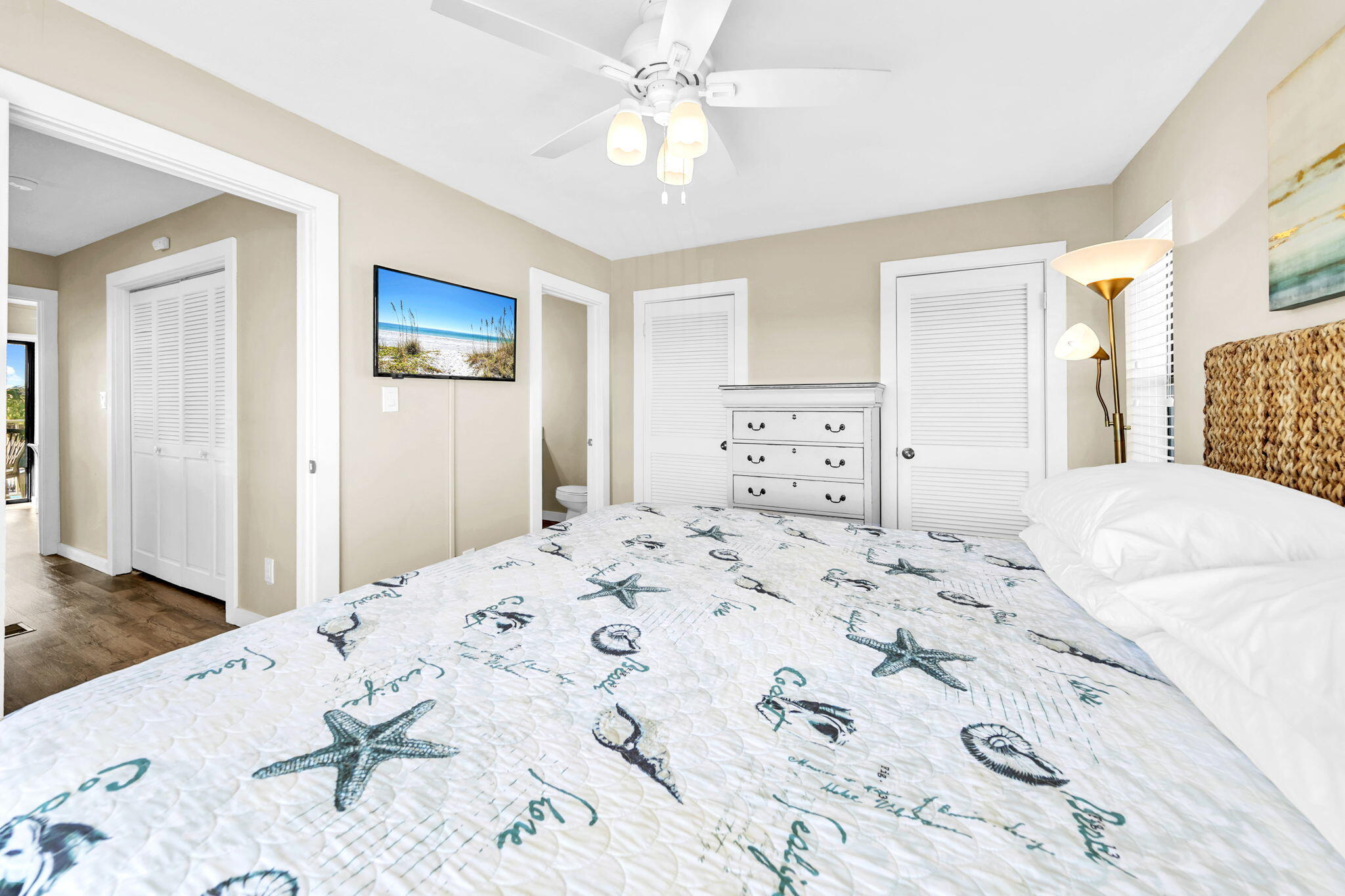 60 Sandprints Drive, Unit C12 Miramar Beach, FL 32550 - Photo 25 of 53 a bedroom with a large bed and a chandelier