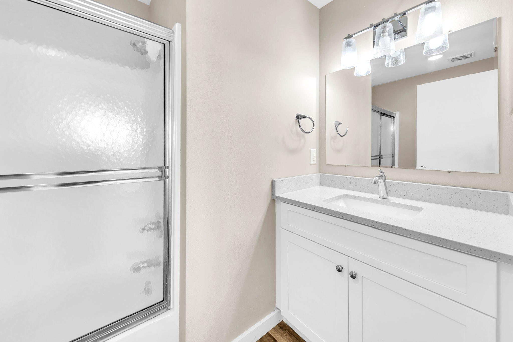 60 Sandprints Drive, Unit C12 Miramar Beach, FL 32550 - Photo 32 of 53 a bathroom with a shower sink and mirror