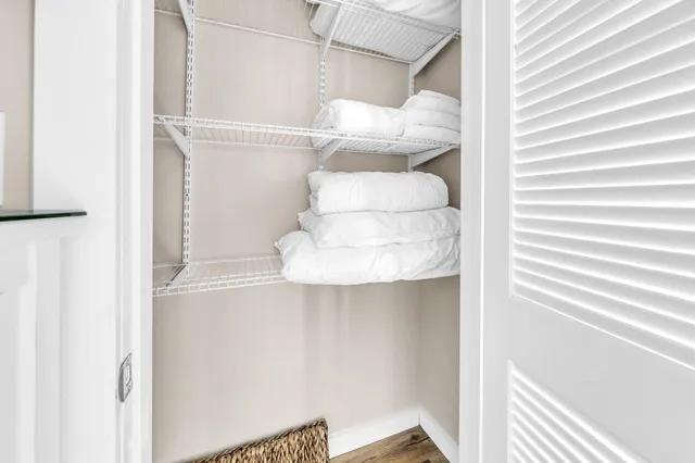 a view of a balcony with lake view and a wooden floor