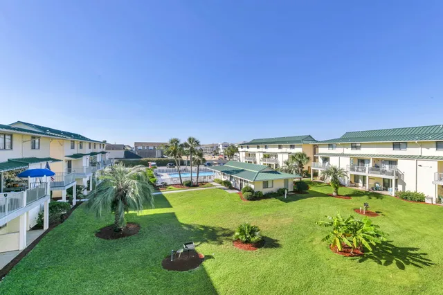 a view of a porch with wooden floor and outdoor space