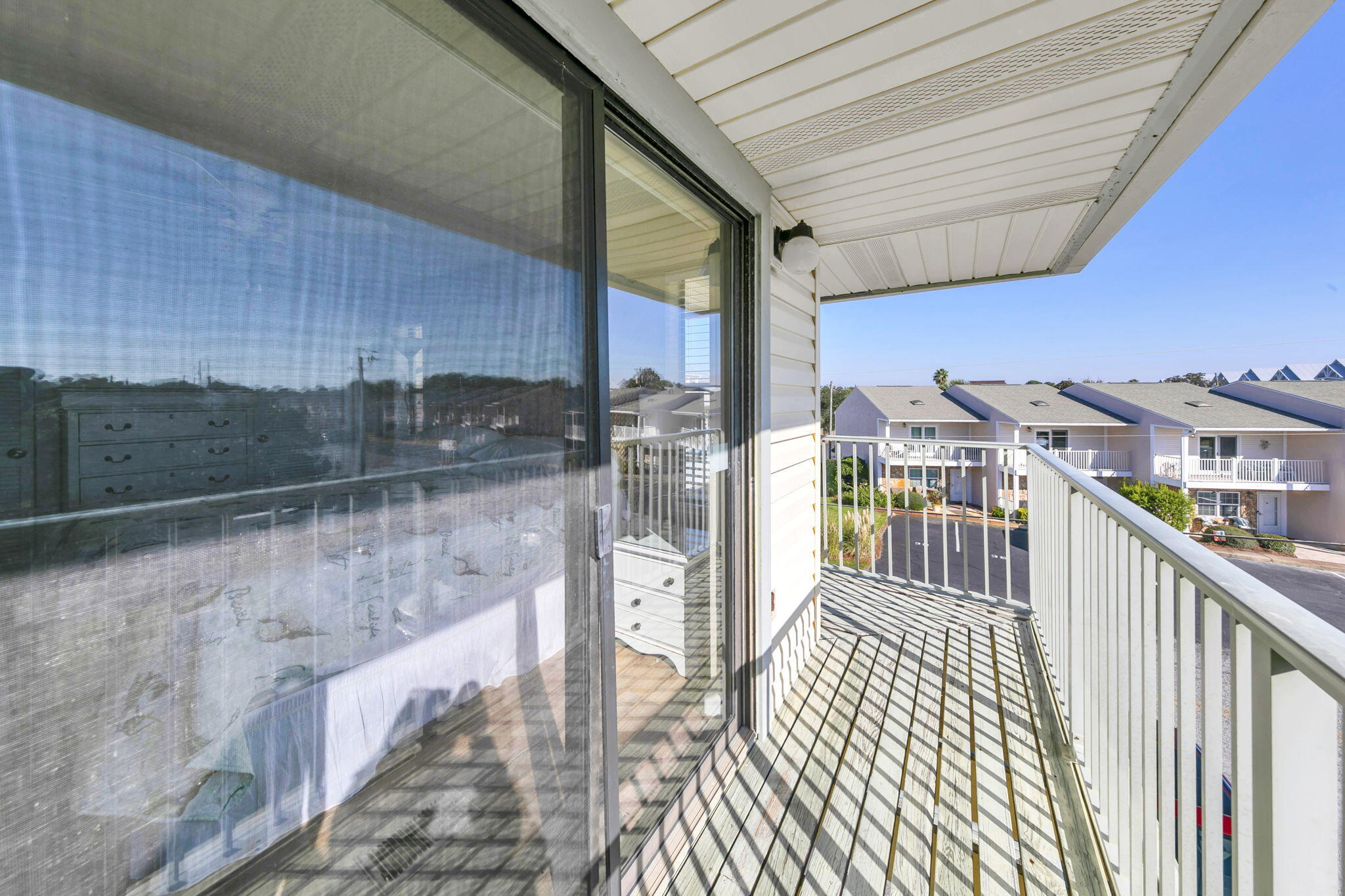 60 Sandprints Drive, Unit C12 Miramar Beach, FL 32550 - Photo 41 of 53 a view of a porch with wooden floor and outdoor space