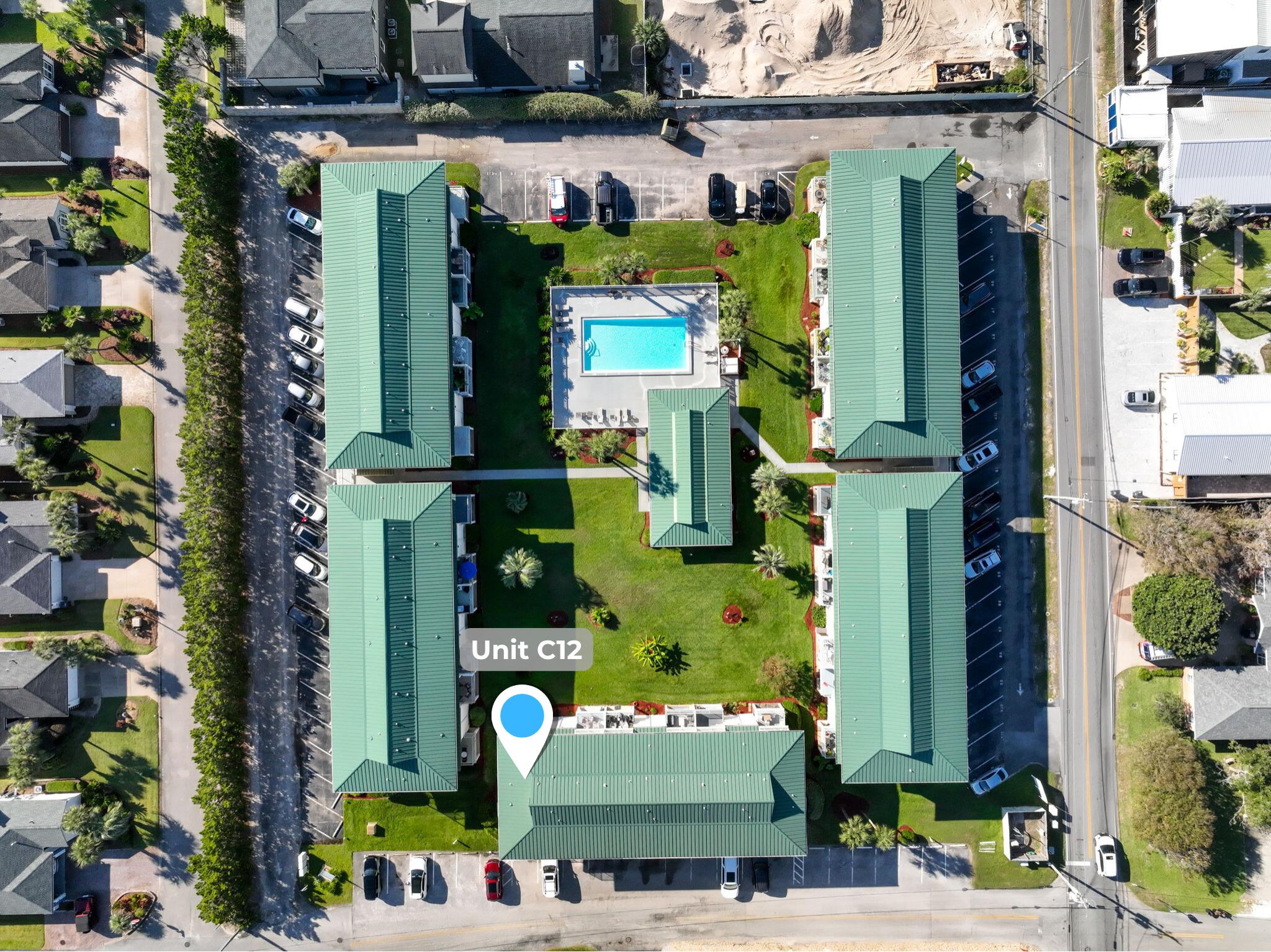 60 Sandprints Drive, Unit C12 Miramar Beach, FL 32550 - Photo 50 of 53 an outdoor space with lots of yellow plants