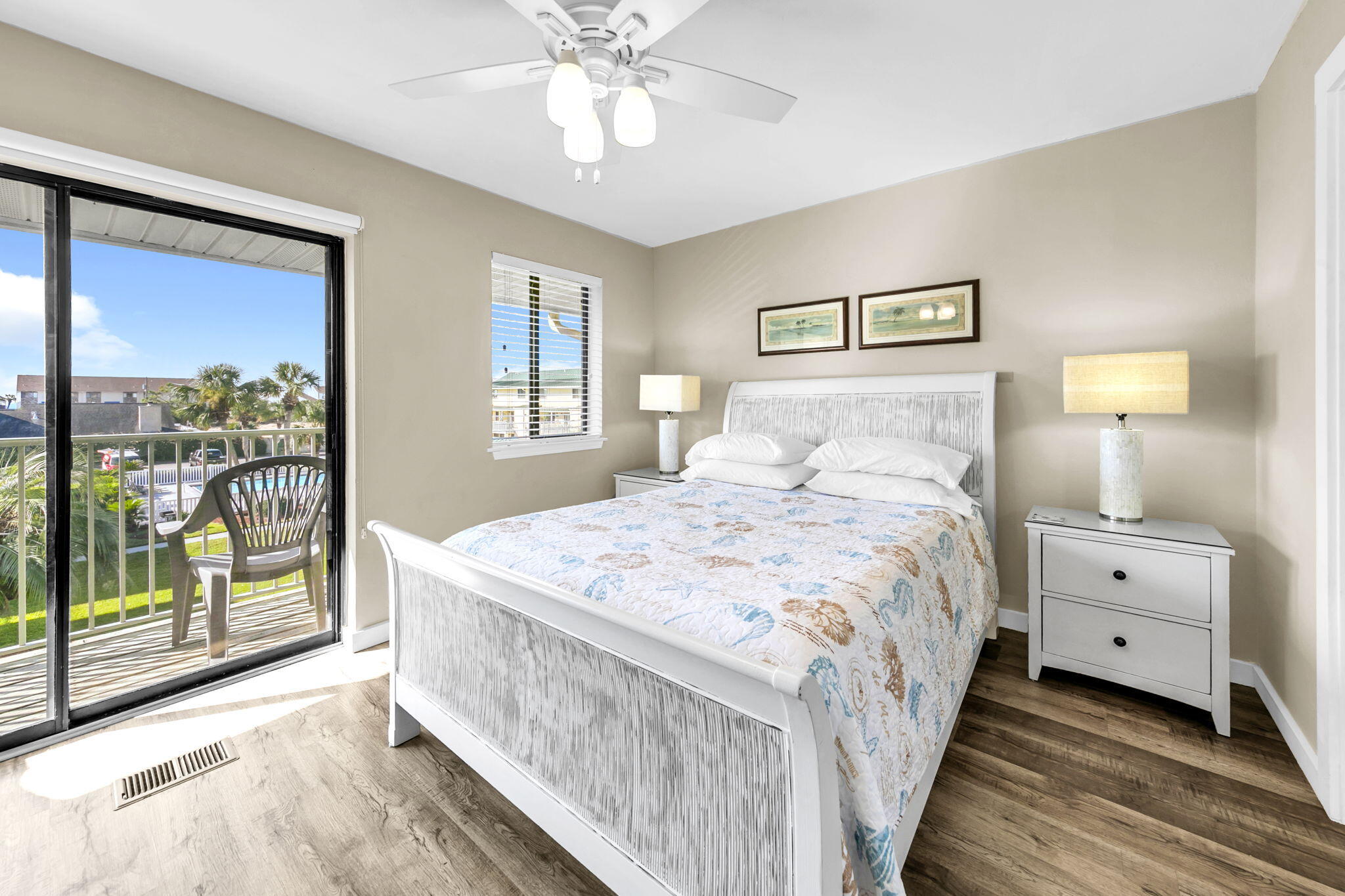60 Sandprints Drive, Unit C12 Miramar Beach, FL 32550 - Photo 5 of 53 a bedroom with a bed and a chandelier