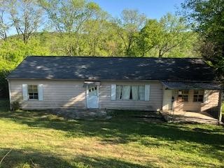 365 Robertsville Road Oak Ridge, TN 37830 - Photo 1 of 3 a front view of a house with a yard