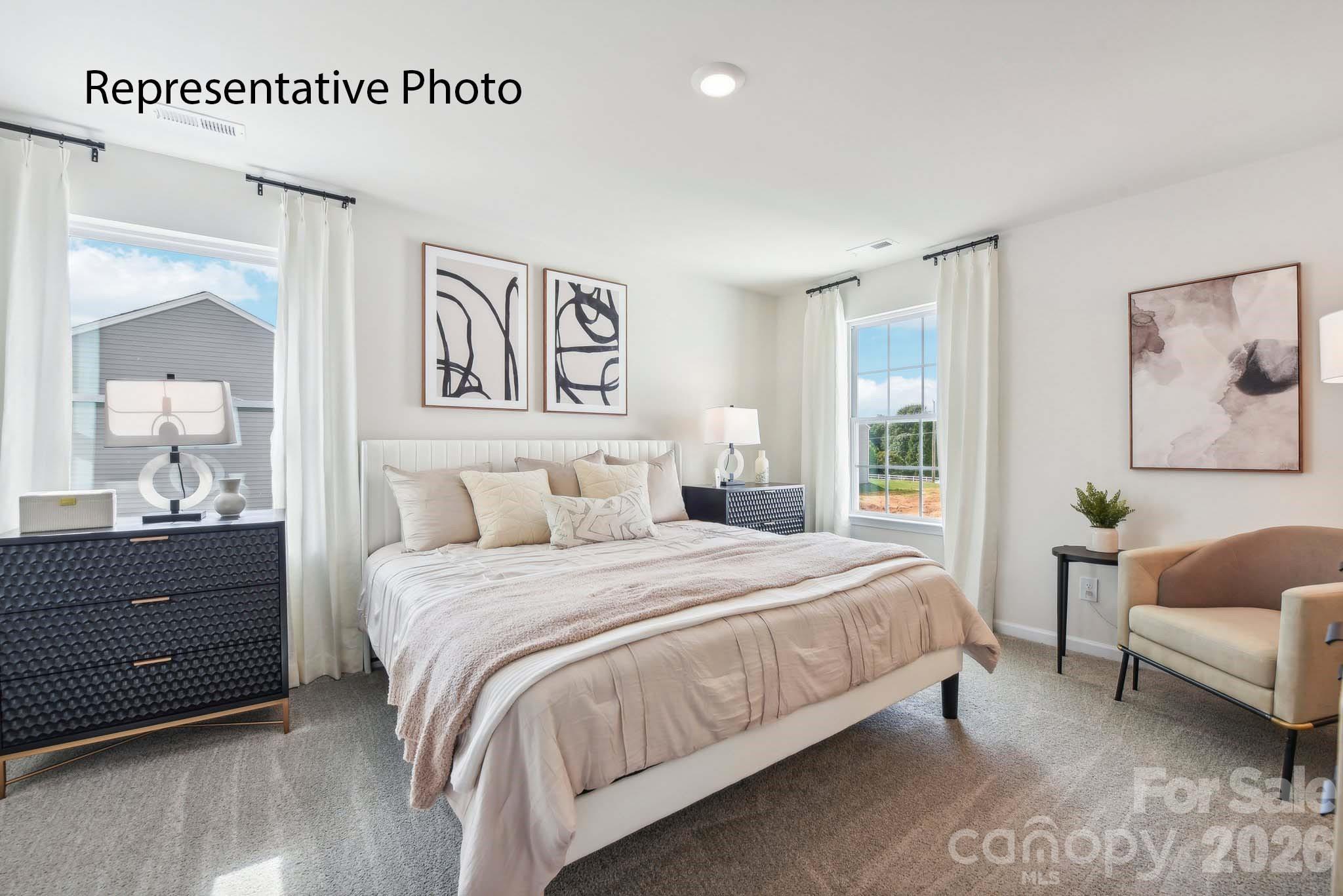 556 North Sparkleberry Street Chester, SC 29706 - Photo 16 of 26 a bedroom with a bed and a couch