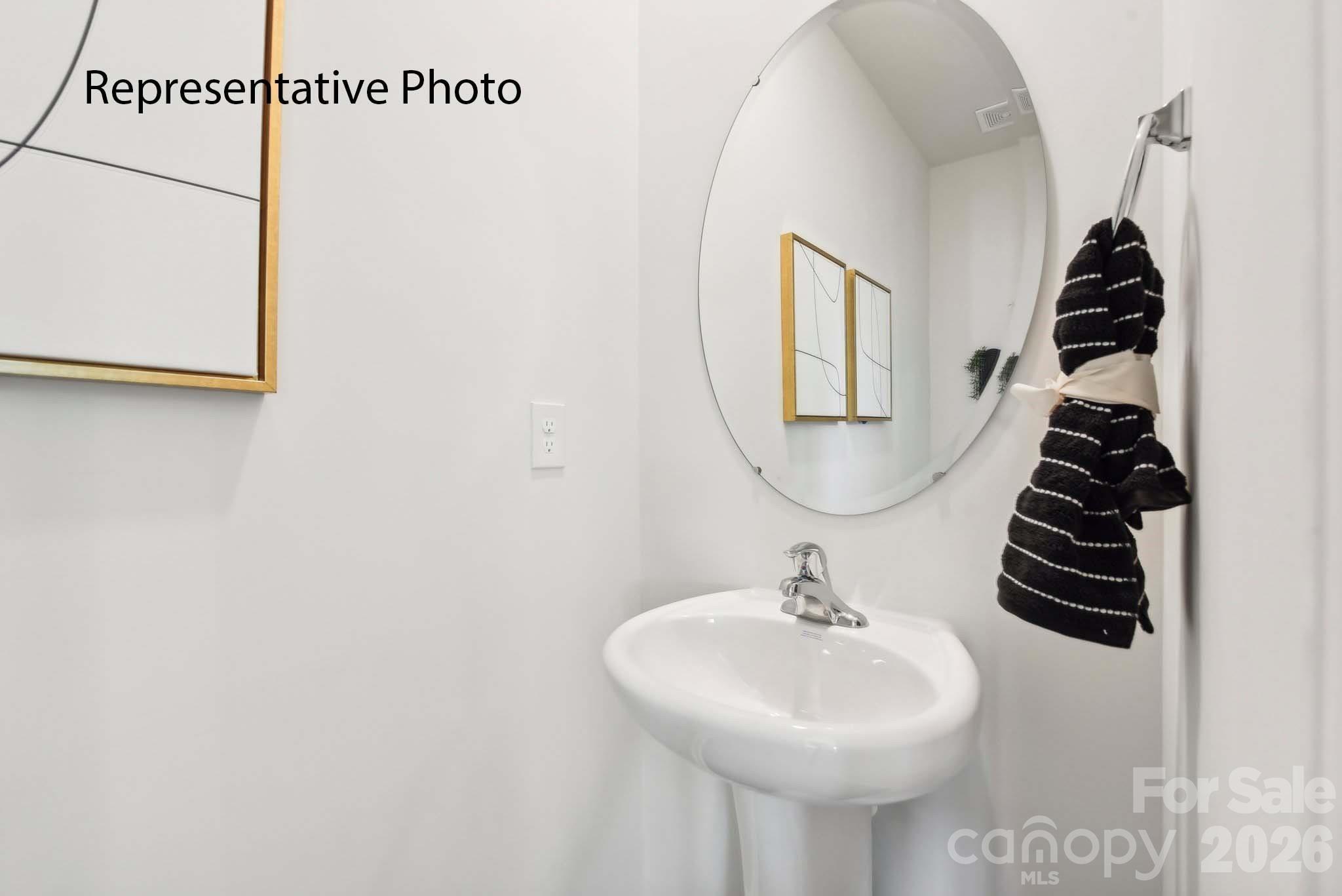 556 North Sparkleberry Street Chester, SC 29706 - Photo 26 of 26 a bathroom with a sink a mirror and a shower