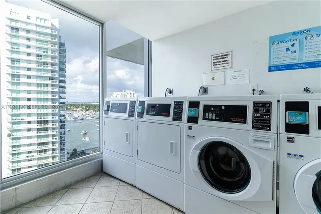 a view of a hallway with washer and dryer